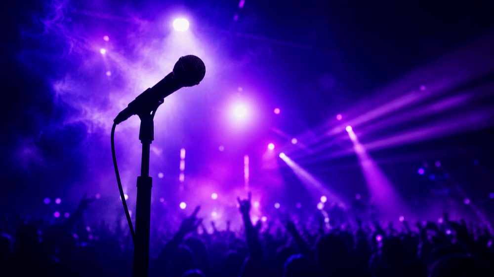 Stage lights with a microphone silhouette.